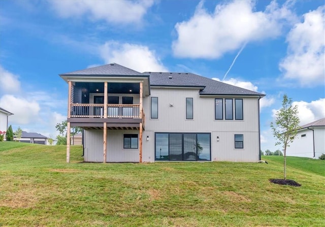 2608 NE Amanda Ln, Blue Springs, MO 64029 - back of property with a lawn, a shingled roof, and a deck