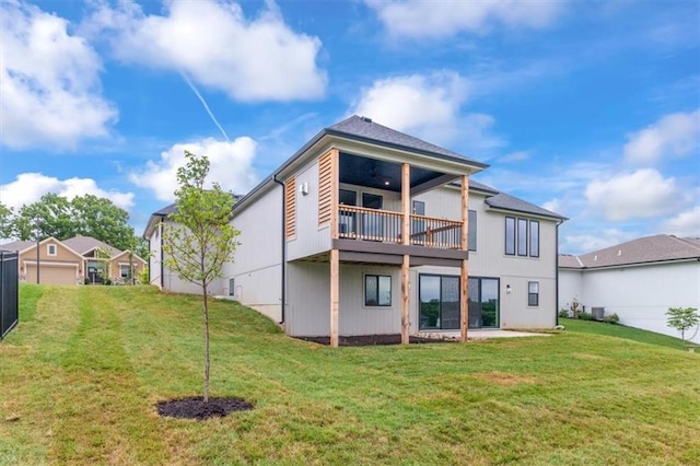 2608 NE Amanda Ln, Blue Springs, MO 64029 - rear view of house with a yard and a balcony