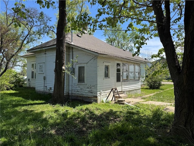 318 S Williams St, Craig, MO 64437 - rear view of property featuring a lawn