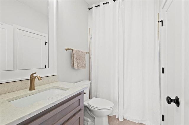 bathroom with vanity, toilet, and a shower with curtain