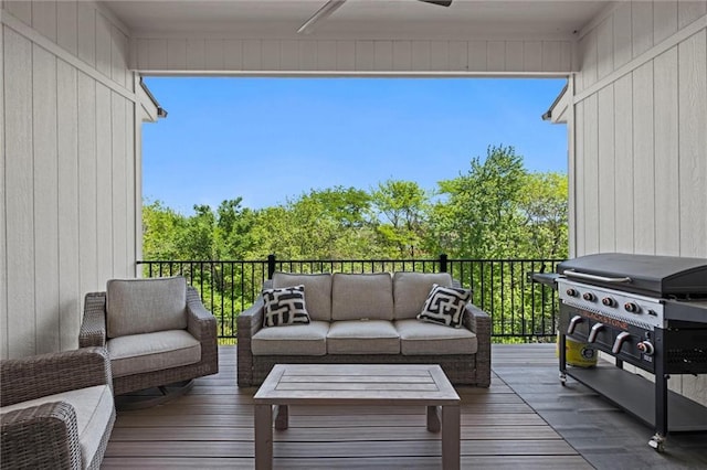 deck with outdoor lounge area and area for grilling