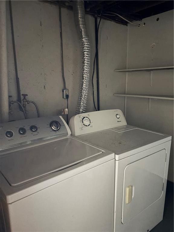 laundry area featuring laundry area and washer and clothes dryer