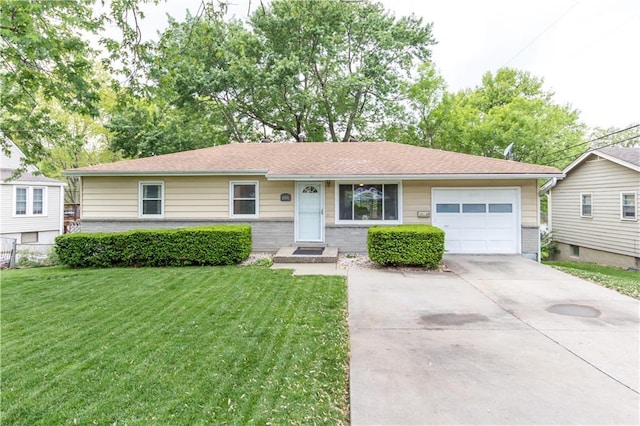 ranch-style home featuring brick siding, an attached garage, driveway, and a front lawn