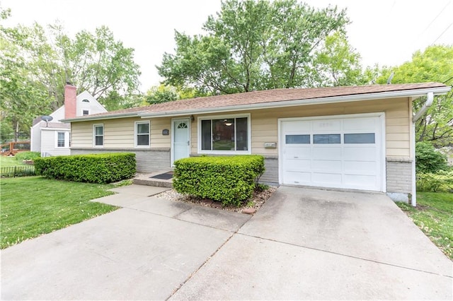 ranch-style home featuring an attached garage, driveway, a front lawn, and brick siding