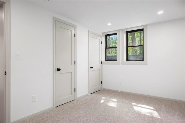 1639 Indiana St, Lawrence, KS 66044 - unfurnished bedroom featuring recessed lighting, light carpet, and baseboards