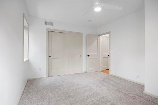 1639 Indiana St, Lawrence, KS 66044 - unfurnished bedroom featuring carpet floors, baseboards, a closet, and a ceiling fan
