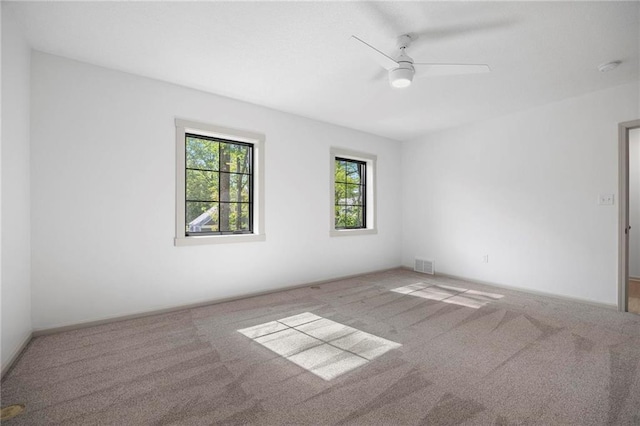 1639 Indiana St, Lawrence, KS 66044 - carpeted spare room with ceiling fan