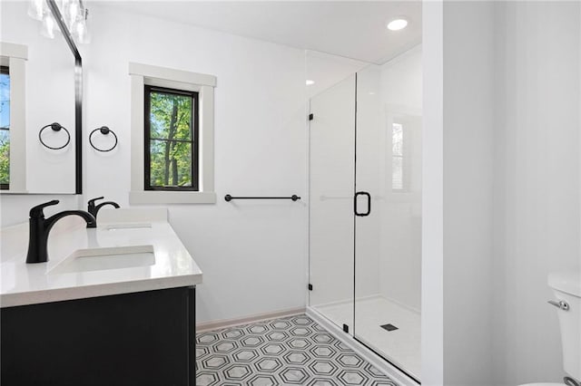 1639 Indiana St, Lawrence, KS 66044 - full bath featuring a stall shower, toilet, and double vanity