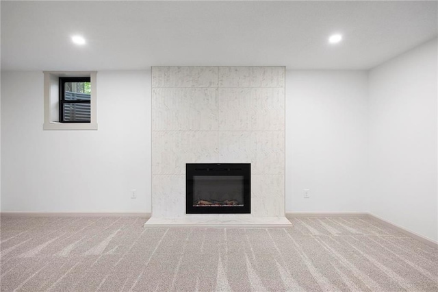 1639 Indiana St, Lawrence, KS 66044 - detailed view of carpet flooring, recessed lighting, baseboards, and a fireplace