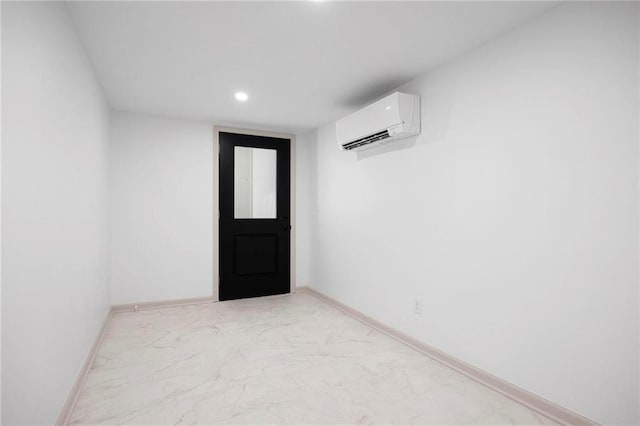 1639 Indiana St, Lawrence, KS 66044 - empty room with a wall mounted AC, light marble finish flooring, recessed lighting, and baseboards
