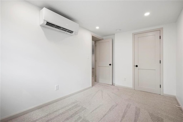 1639 Indiana St, Lawrence, KS 66044 - basement with a wall mounted air conditioner, recessed lighting, baseboards, and carpet floors