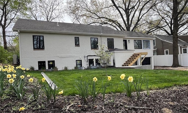 1639 Indiana St, Lawrence, KS 66044 - back of house with stairway and stucco siding