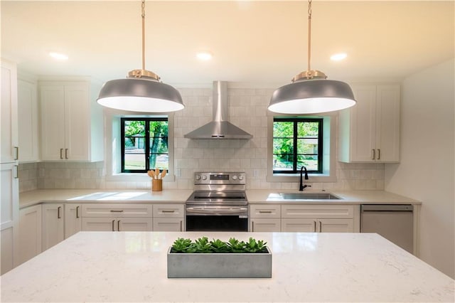 1639 Indiana St, Lawrence, KS 66044 - kitchen featuring stainless steel electric range, wall chimney exhaust hood, a sink, dishwasher, and healthy amount of natural light
