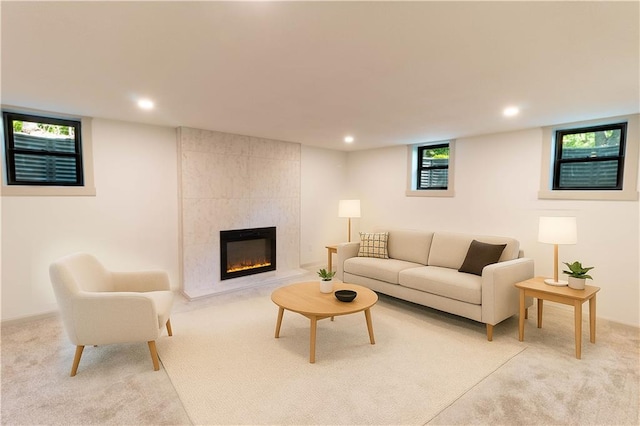 1639 Indiana St, Lawrence, KS 66044 - living room with light colored carpet, recessed lighting, and a tile fireplace