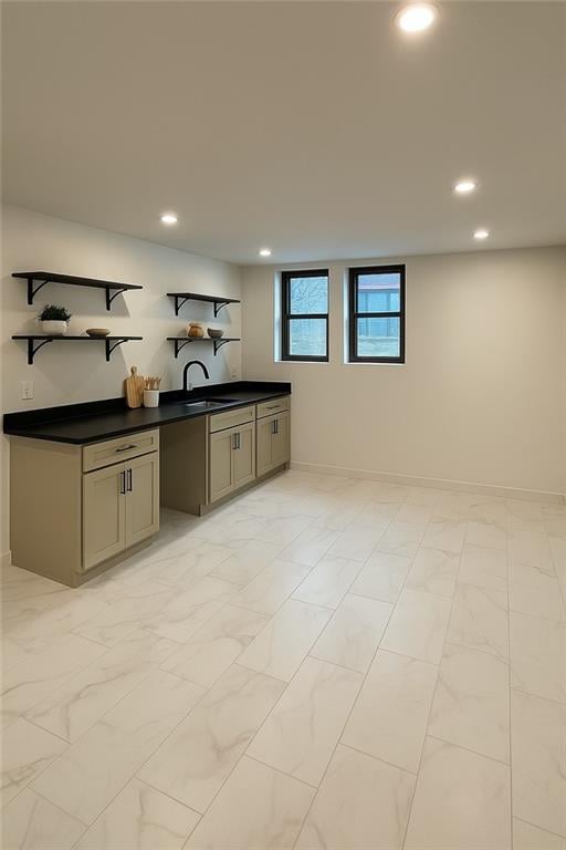 1639 Indiana St, Lawrence, KS 66044 - kitchen featuring dark countertops, open shelves, recessed lighting, a sink, and baseboards