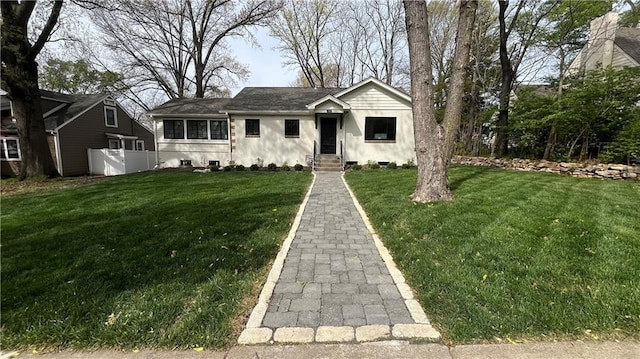 1639 Indiana St, Lawrence, KS 66044 - view of front facade featuring a front lawn and stucco siding
