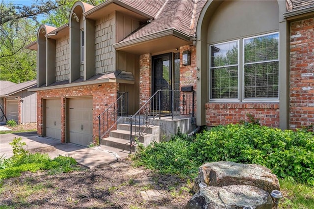 view of front of home with concrete driveway, brick siding, and an attached garage