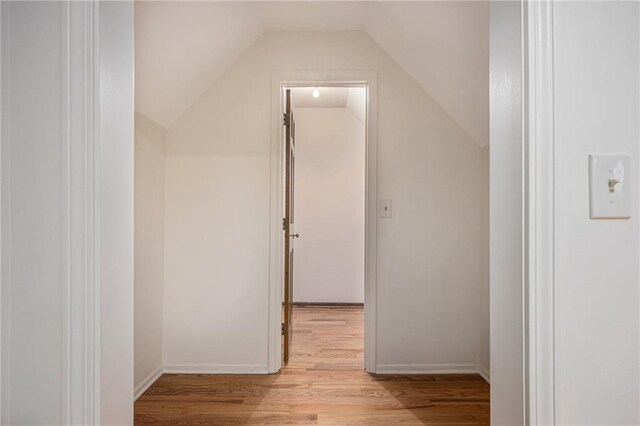 bonus room with wood finished floors and lofted ceiling