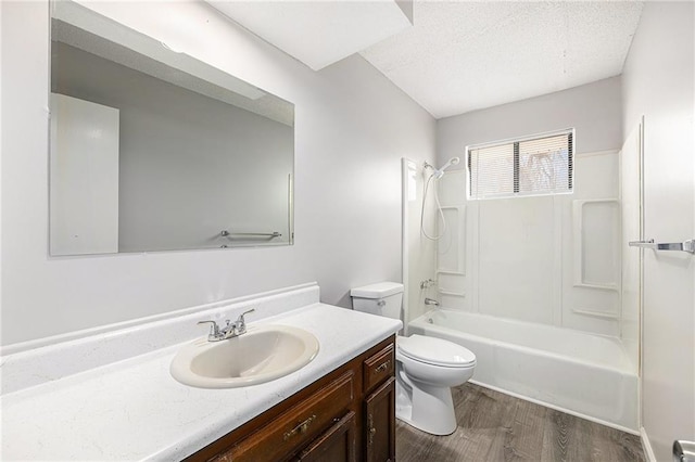 full bath with vanity, visible vents, shower / bathtub combination, wood finished floors, and toilet