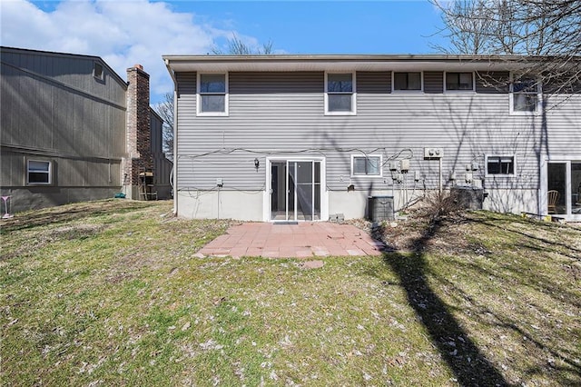 back of house featuring a yard and a patio area