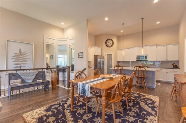 6529 Barth Rd, Shawnee, KS 66226 - dining room featuring a high ceiling, dark wood-type flooring, and recessed lighting