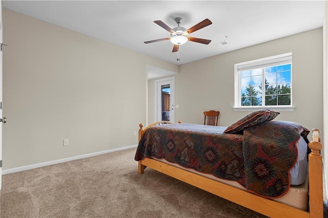 6529 Barth Rd, Shawnee, KS 66226 - carpeted bedroom with baseboards and ceiling fan