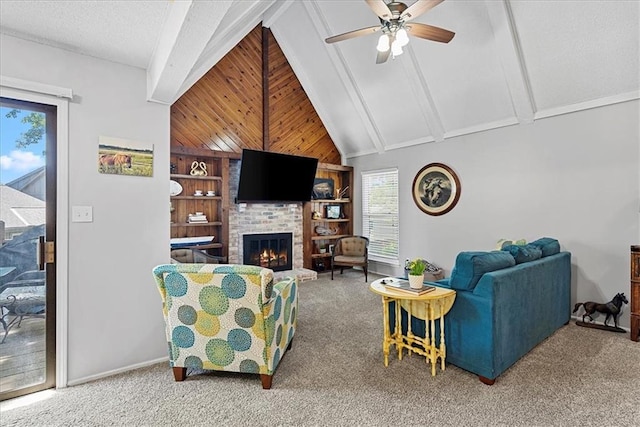 living room featuring carpet flooring, a ceiling fan, and a brick fireplace