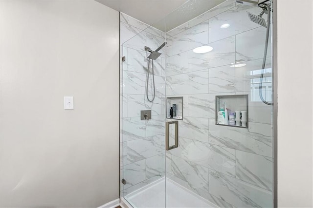 bathroom with a shower stall