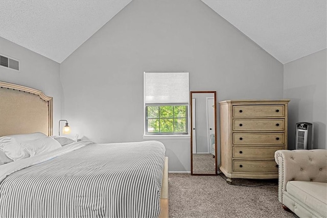 bedroom featuring light colored carpet and high vaulted ceiling