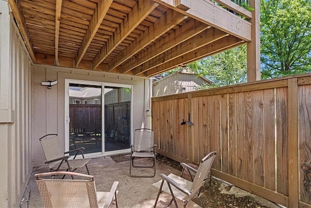 view of patio featuring fence