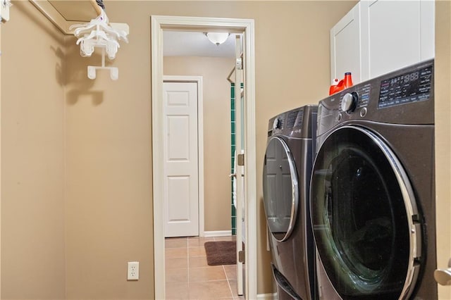 14 Emerald Shore Dr, Lake Tapawingo, MO 64015 - washroom with washer and dryer, cabinet space, tile patterned floors, and baseboards