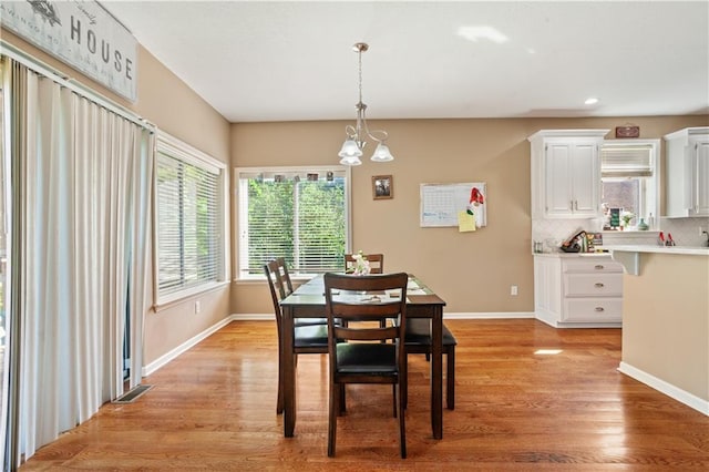 14 Emerald Shore Dr, Lake Tapawingo, MO 64015 - dining space featuring light wood-style floors, baseboards, a chandelier, and recessed lighting