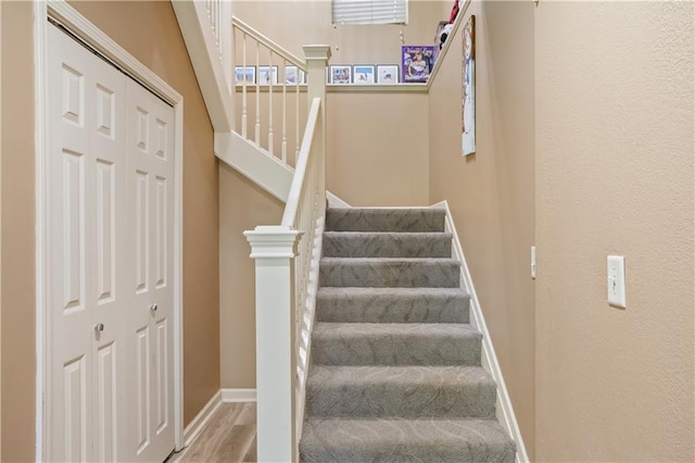 14 Emerald Shore Dr, Lake Tapawingo, MO 64015 - staircase featuring wood finished floors and baseboards