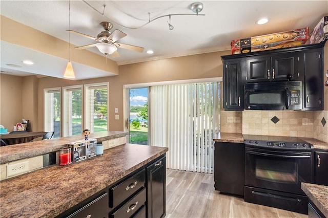 14 Emerald Shore Dr, Lake Tapawingo, MO 64015 - kitchen with black appliances, dark cabinetry, backsplash, a ceiling fan, and hanging light fixtures