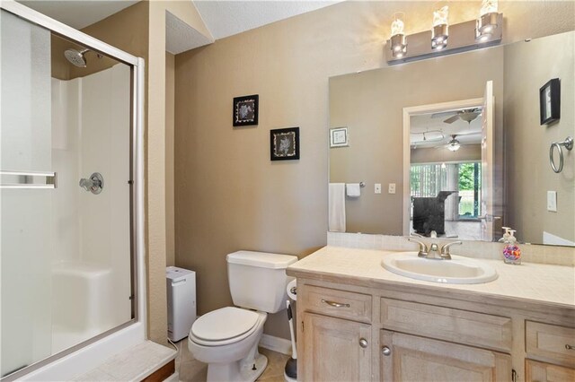 14 Emerald Shore Dr, Lake Tapawingo, MO 64015 - bathroom featuring a shower stall, toilet, and vanity