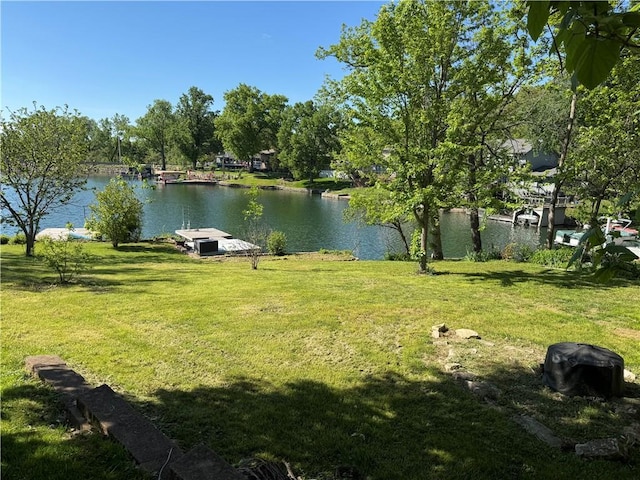 14 Emerald Shore Dr, Lake Tapawingo, MO 64015 - view of grassy yard with a water view and a boat dock