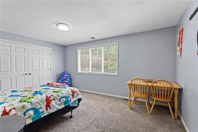 14 Emerald Shore Dr, Lake Tapawingo, MO 64015 - carpeted bedroom featuring a closet and a textured ceiling