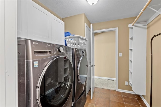 14 Emerald Shore Dr, Lake Tapawingo, MO 64015 - laundry area with washer and dryer, cabinet space, a textured ceiling, and tile patterned floors