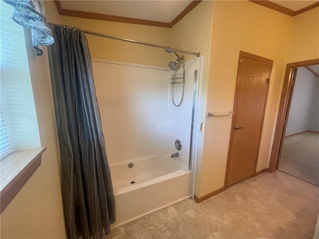 bathroom featuring baseboards, shower / tub combo, and crown molding