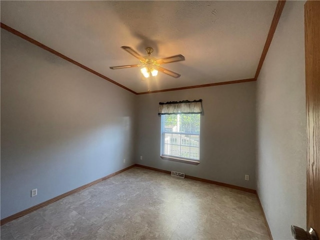 empty room with light floors, ornamental molding, visible vents, a ceiling fan, and baseboards