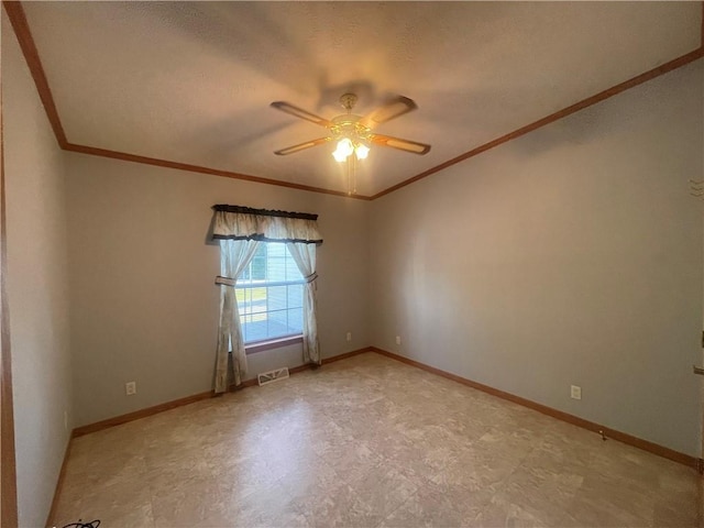 empty room with light floors, visible vents, crown molding, a ceiling fan, and baseboards