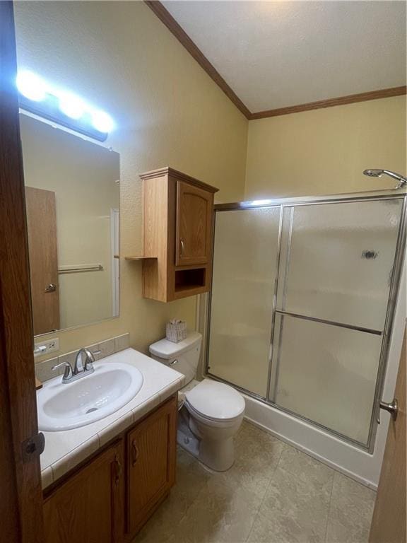 full bathroom featuring toilet, a shower with door, vanity, and crown molding