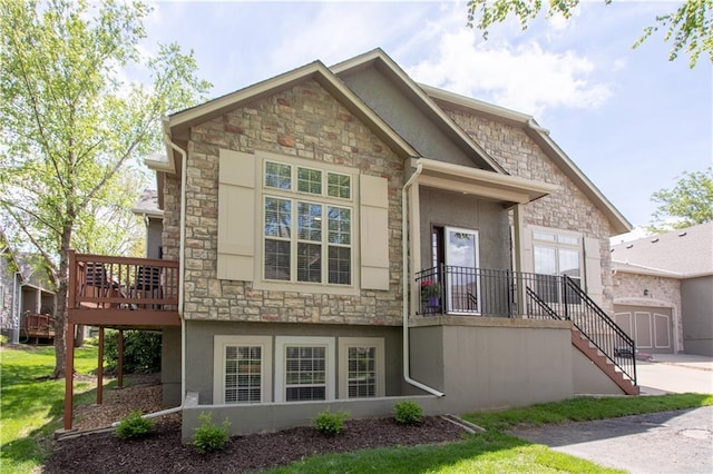 view of front facade featuring stone siding, stairs, stucco siding, and a deck