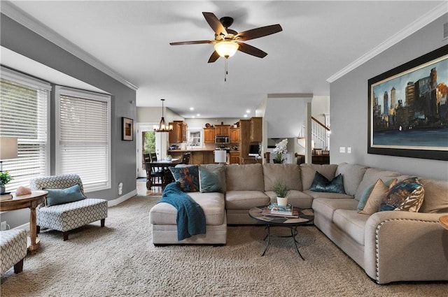 21511 W 100th Ter, Lenexa, KS 66220 - living room featuring ceiling fan, crown molding, a chandelier, stairway, and light colored carpet