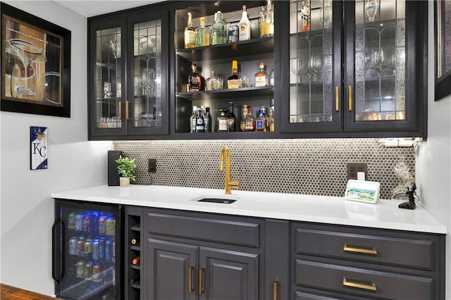 21511 W 100th Ter, Lenexa, KS 66220 - indoor wet bar featuring wine cooler and decorative backsplash