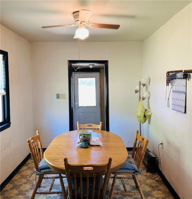 8480 NW High St Unit B, Amsterdam, MO 64723 - dining room featuring dark floors, baseboards, and ceiling fan
