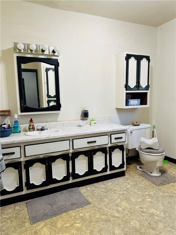 8480 NW High St Unit B, Amsterdam, MO 64723 - bathroom with vanity and toilet