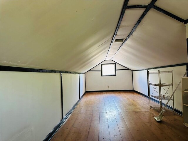 8480 NW High St Unit B, Amsterdam, MO 64723 - additional living space featuring wood-type flooring, baseboards, and lofted ceiling