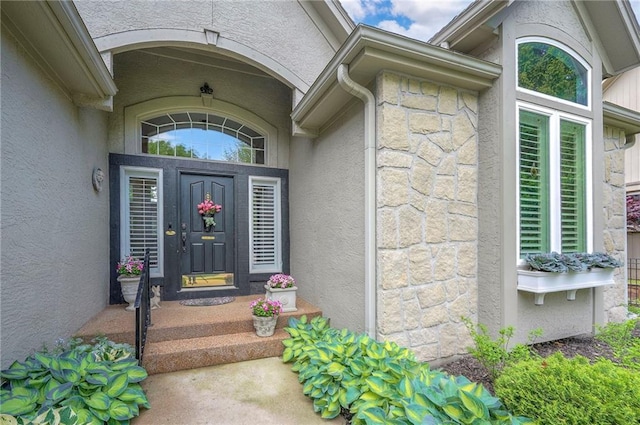 2945 W 143rd Ter, Leawood, KS 66224 - property entrance featuring stone siding and stucco siding