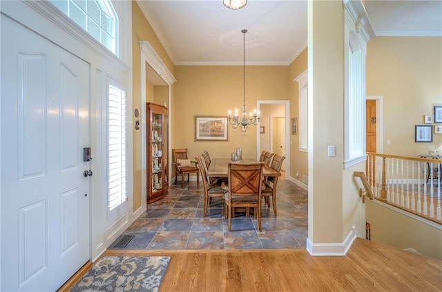2945 W 143rd Ter, Leawood, KS 66224 - dining space featuring plenty of natural light, baseboards, ornamental molding, and a chandelier